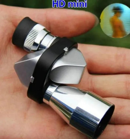 Compact aluminium alloy 8x20mm monocular telescope with canvas bag and cleaning cloth on a table.