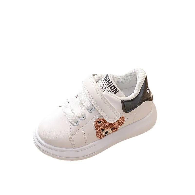 Baby Bear cartoon pattern children's sneakers in green, shown on a white background.