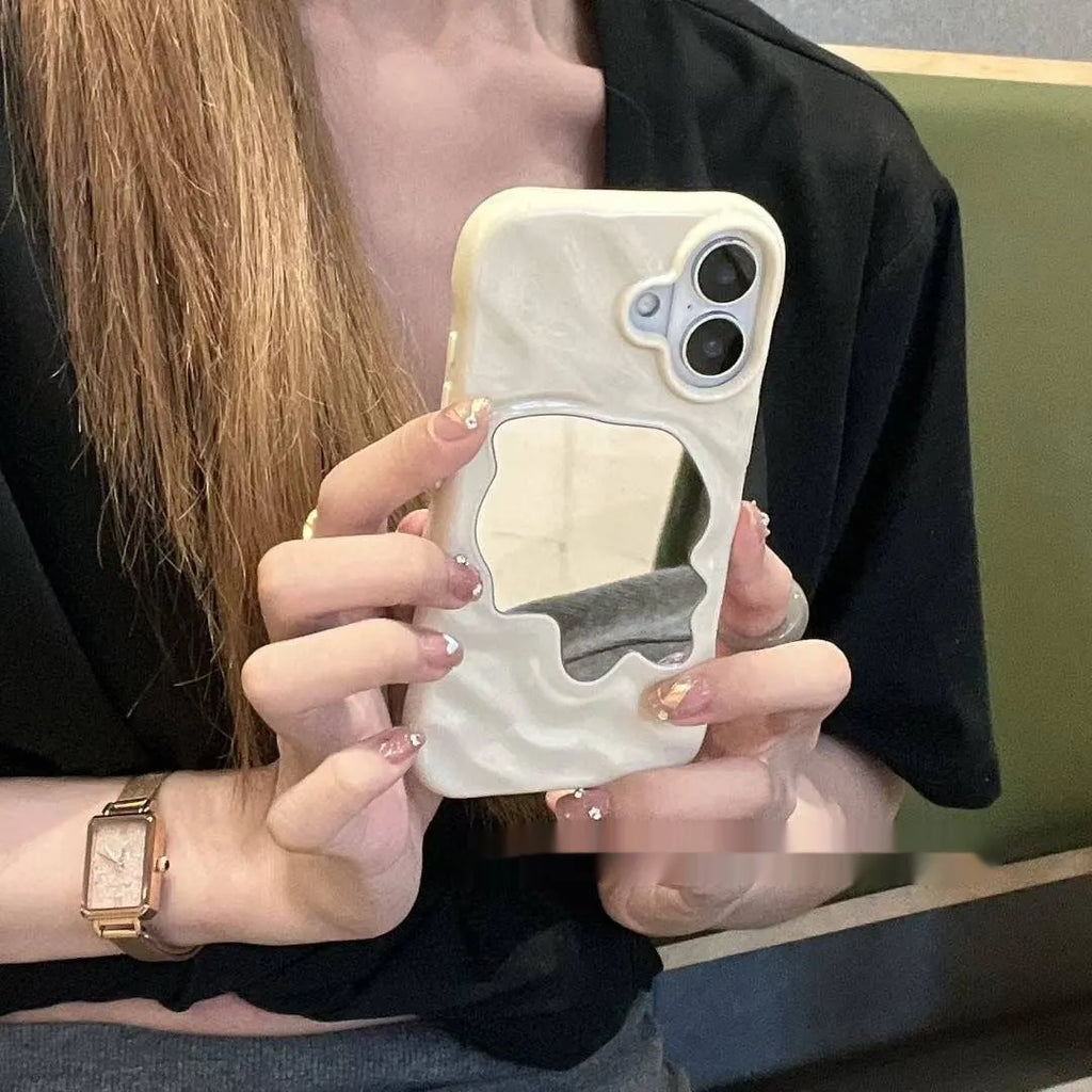 Solid colour phone case with a built-in mirror for iPhone models, shown in beige and purple.