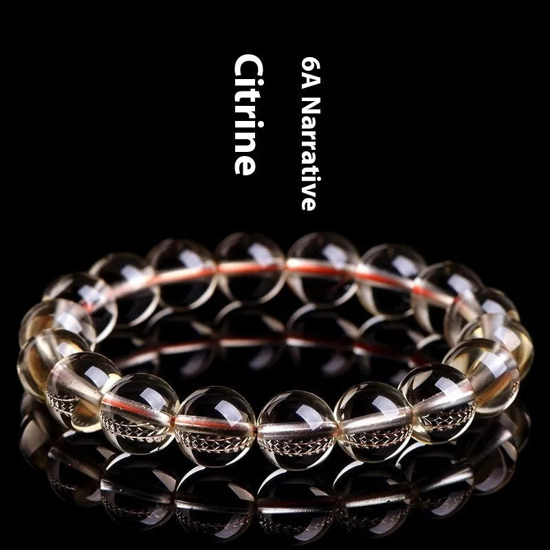 Natural citrine scattered beads ball bracelet in 7A and 6A colour grades on a wrist.