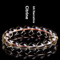 Natural citrine scattered beads ball bracelet in 7A and 6A colour grades on a wrist.