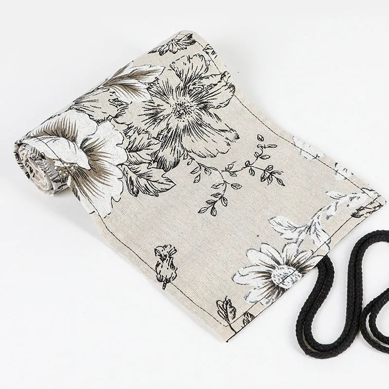 Black Peony printed canvas pencil roll bag open to show 24 or 72 holes for pencils on cotton hemp fabric.