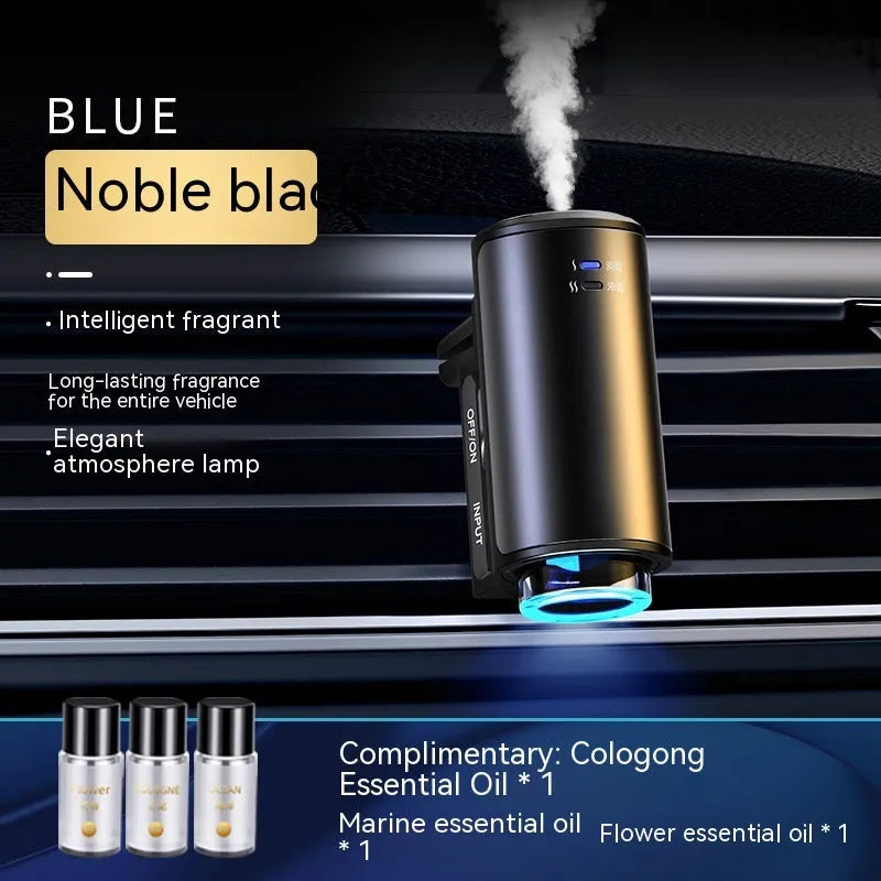 Smart car vent clip aroma diffuser in obsidian black with three bottles of essential oil