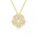Dual-wear summer mori necklace with copper heart pendant and flower elements in gold colour on woman