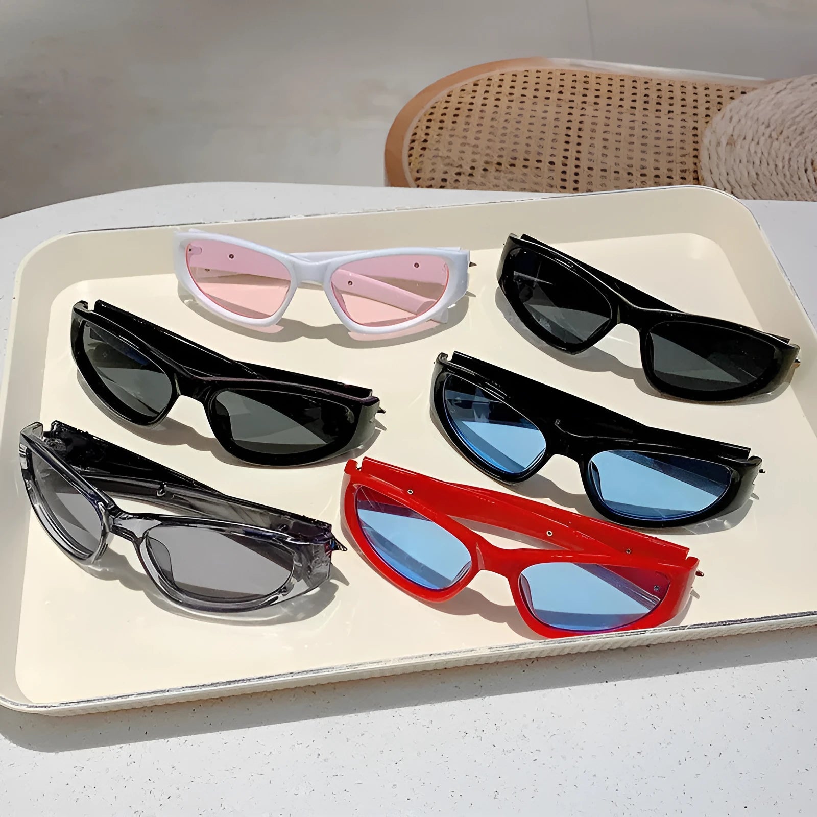 Polycarbonate windproof sunglasses in multiple colour options including black frame with blue lens.