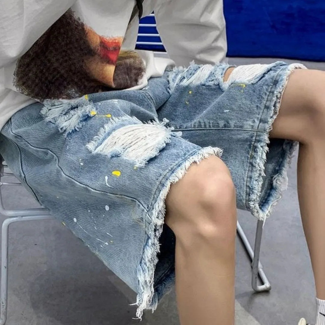 Men's loose fit water washed denim shorts with hole detailing in black and light blue colours