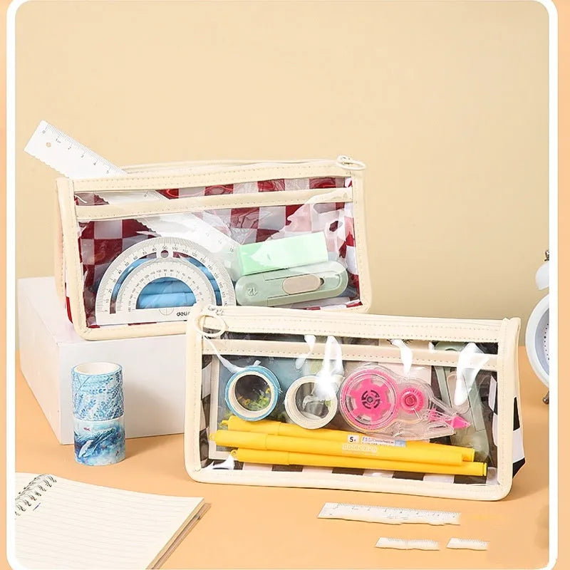 Large transparent PVC pencil case with chessboard grid pattern in black and white plaid.