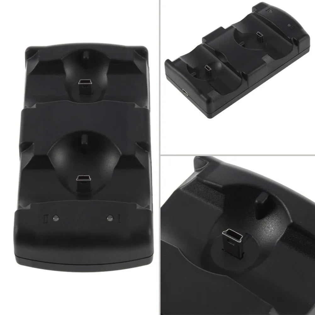 Black plastic dual USB charging dock for PlayStation 3 wireless controllers on a table.