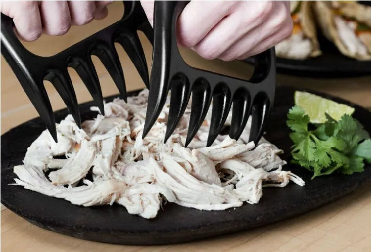 Two black bear claw design meat shredder forks with decorative patterns