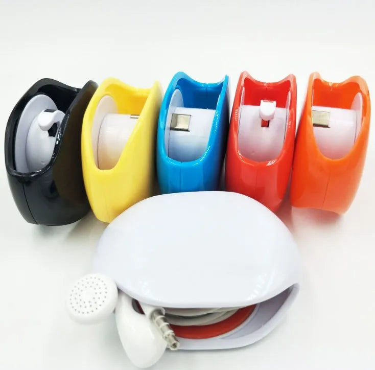 Automatic earphone cable retractor winder in multiple colours on a white background.