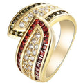 Gold women's ring with green peridot stone on finger, showing metallic finish and stone detail