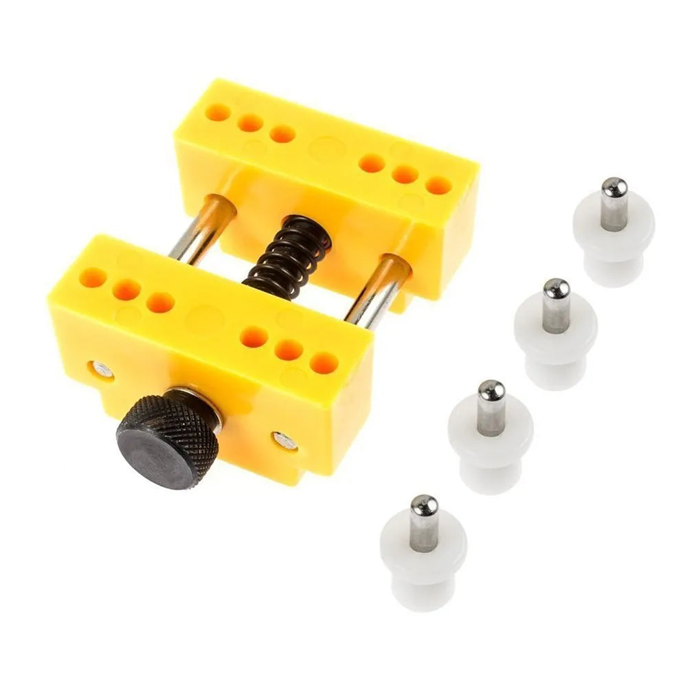 Yellow plastic watch fixing base and plastic case opener tool for watch repair.