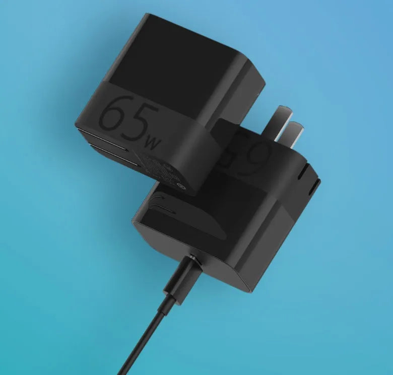 Black ZMI USB-C 65W GaN laptop power adapter showing compact size