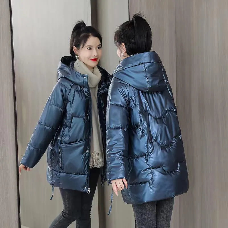 A woman's loose-fit hooded winter jacket in a thick fabric, shown in a choice of colours.
