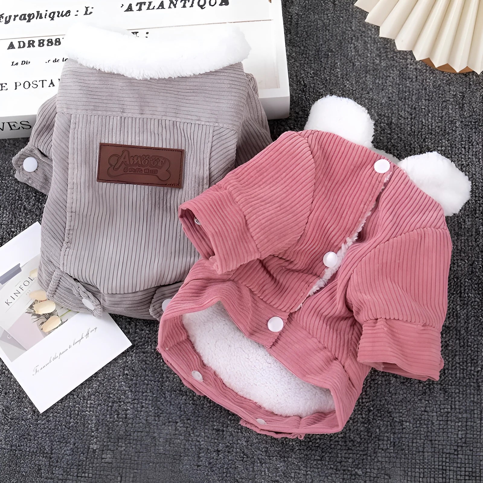 A grey lambswool vest for dogs with fleece lining, shown on a mannequin.