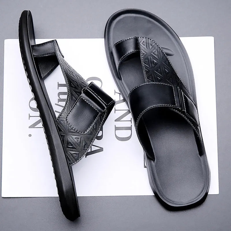 Men's light brown open-toe beach slippers made from cowhide leather with a rubber sole.