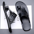 Men's light brown open-toe beach slippers made from cowhide leather with a rubber sole.