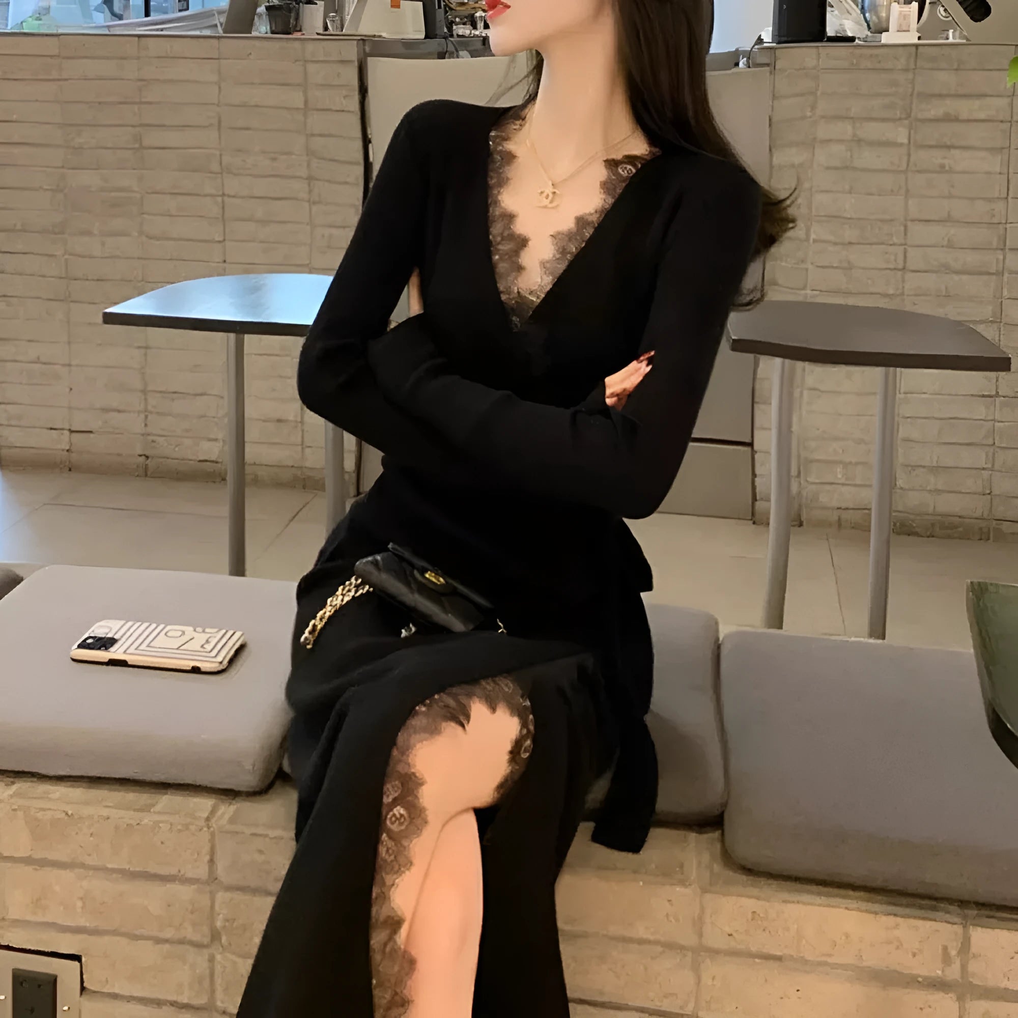 Black women's slim fit woolen skirt dress with a midi length and princess cut.