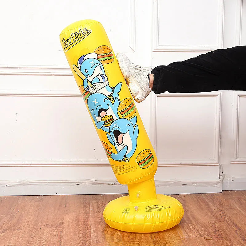 Tall yellow inflatable boxing column standing upright on a floor.