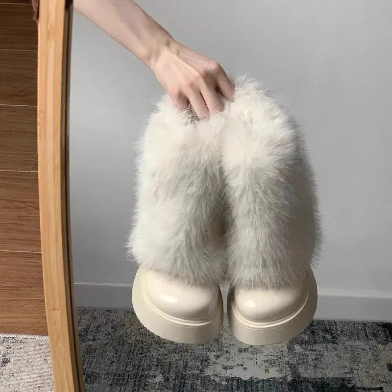 Women's black fleece-lined snow boot with a round toe and mid rubber heel on a white background.