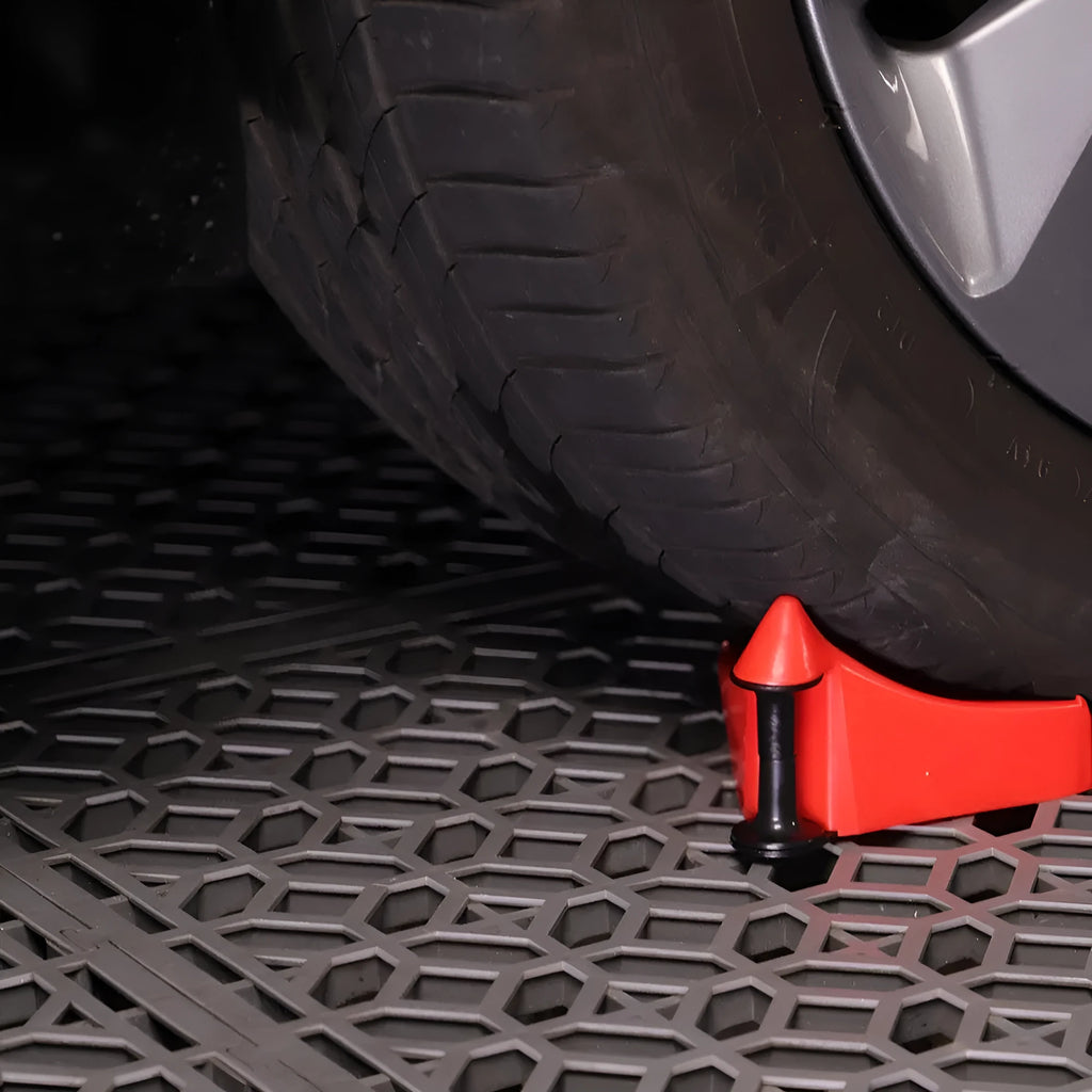 Four red plastic triangular car parking blocks with non-slip rubber surfaces for tyre security