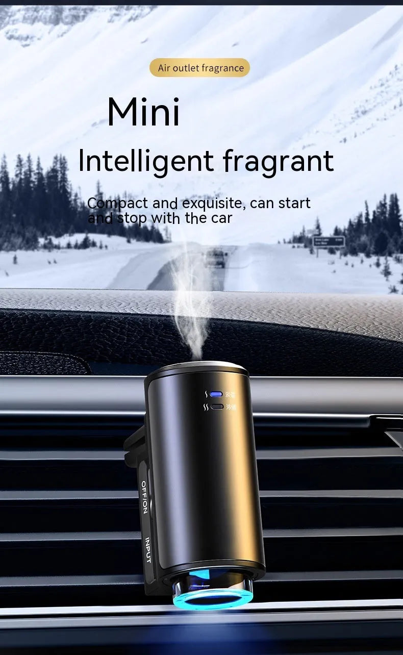 Smart car vent clip aroma diffuser in obsidian black with three bottles of essential oil