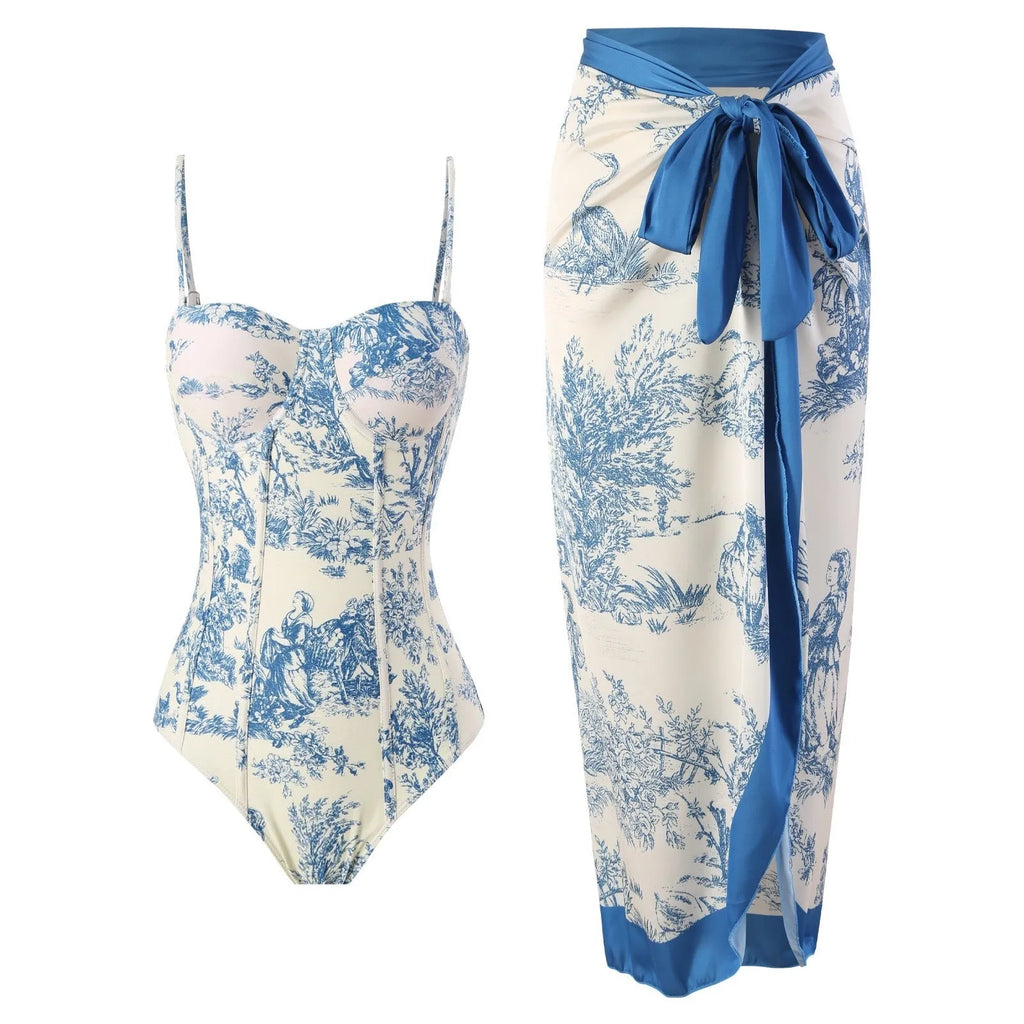 Blue patterned one-piece swimsuit for women with a matching gauze skirt.