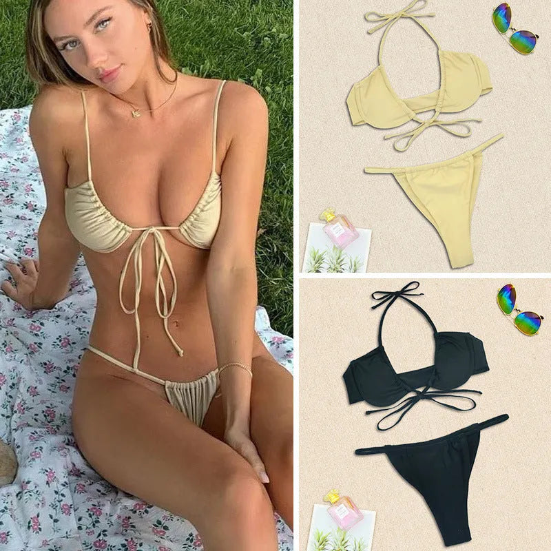 Women's black and mint green two-piece nylon bikini swimsuit laid flat.