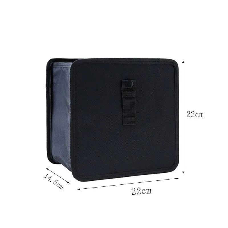 Black car hanging trash can with handle, made from Oxford cloth, shown folded and open