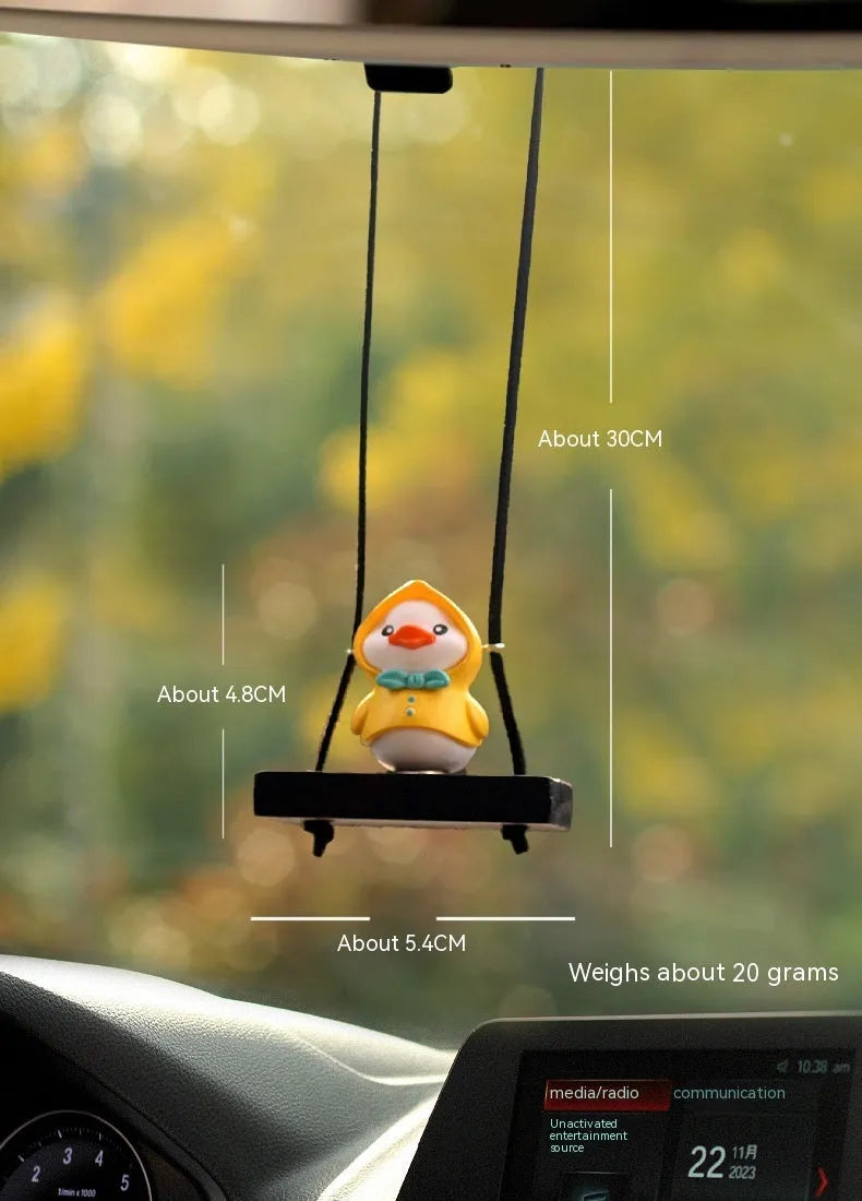 Cute little yellow plastic duck doll car hanging ornament in cartoon style.