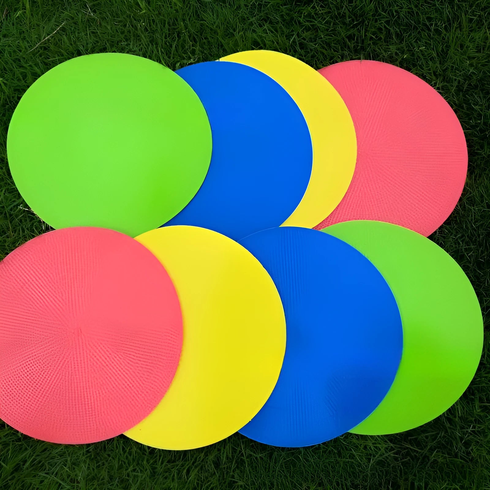 Soft circular football training target pad in bright colours measuring 23cm across