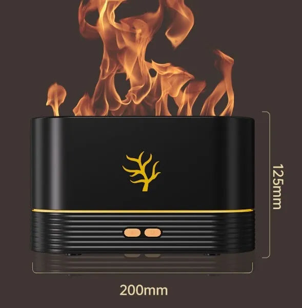 Black square USB aroma diffuser with LED flame light effect and mist output on a wooden table.