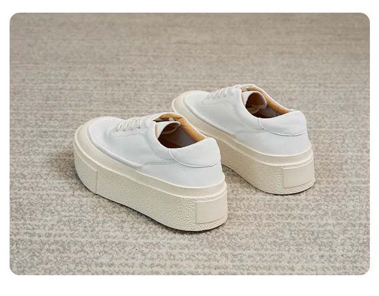 Women's black embossed cowhide platform sports board shoes with a rubber sole.
