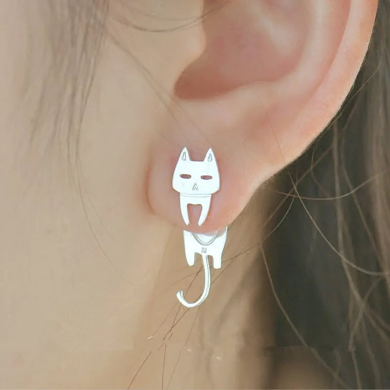 S925 sterling silver stud earrings with asymmetrical cat and fish design on white background