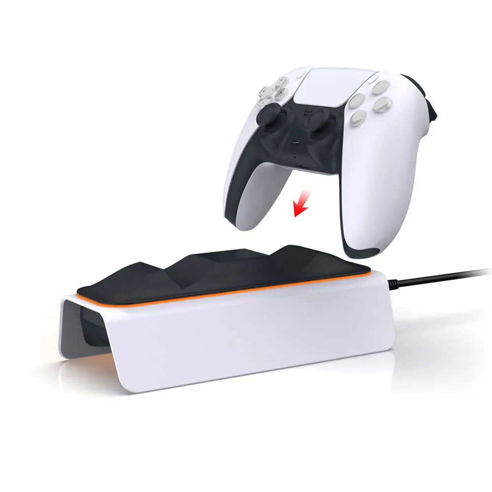 White PS5 dual controller charger with LED indicators and two gamepads docked on a wooden desk