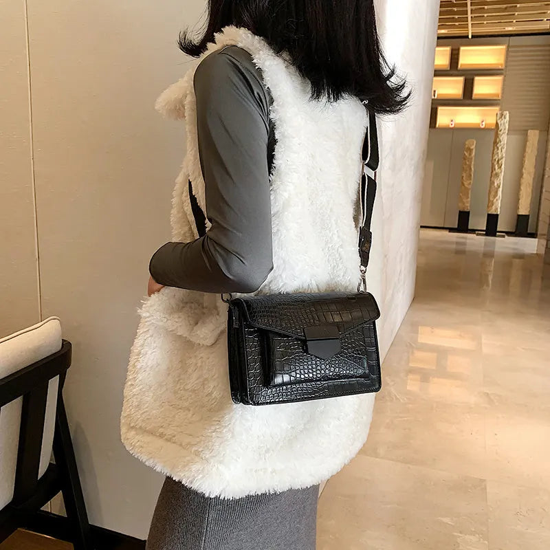 Vintage-style black PU crossbody bag with adjustable strap showing interior
