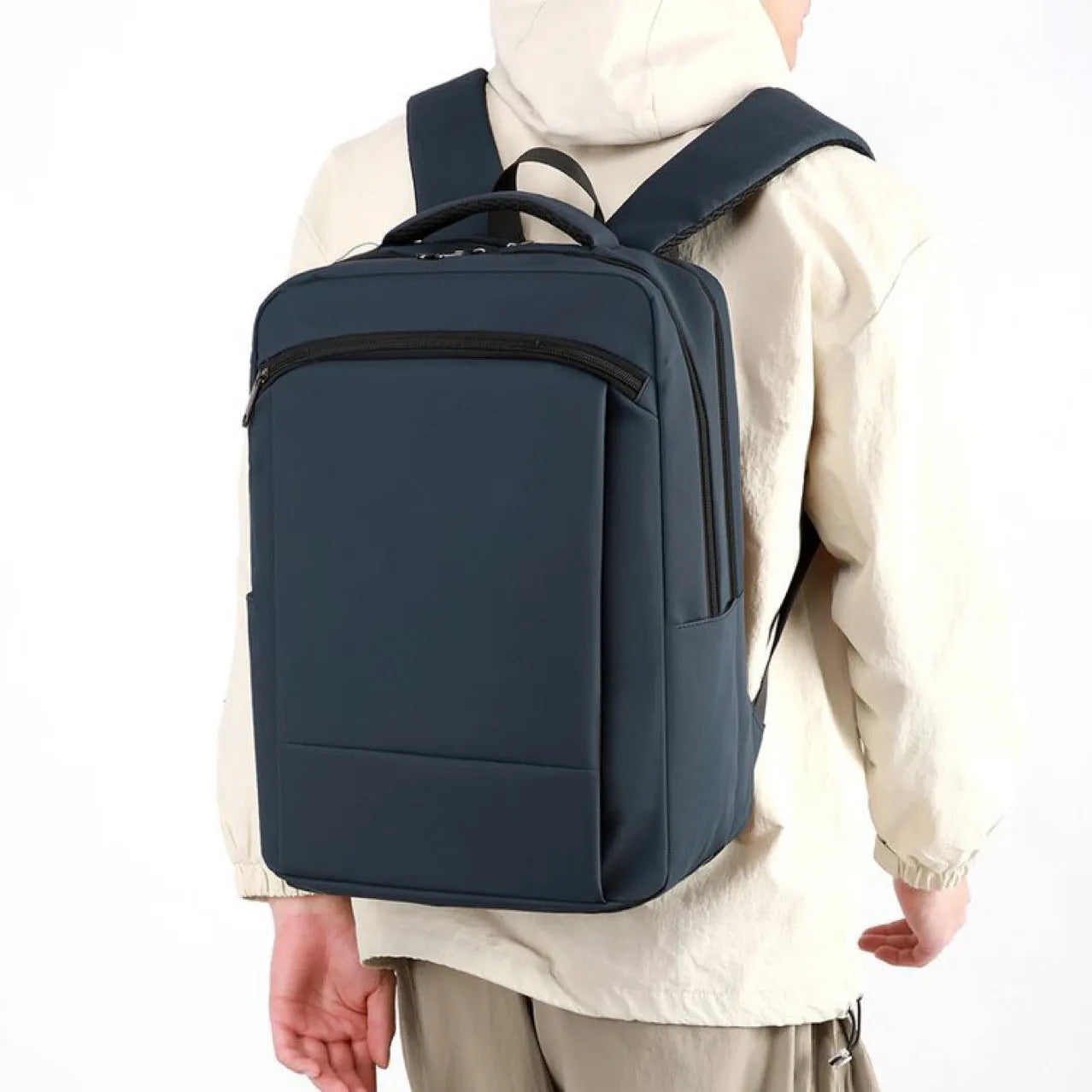 Large capacity waterproof business commute backpack in dark blue with curved shoulder strap