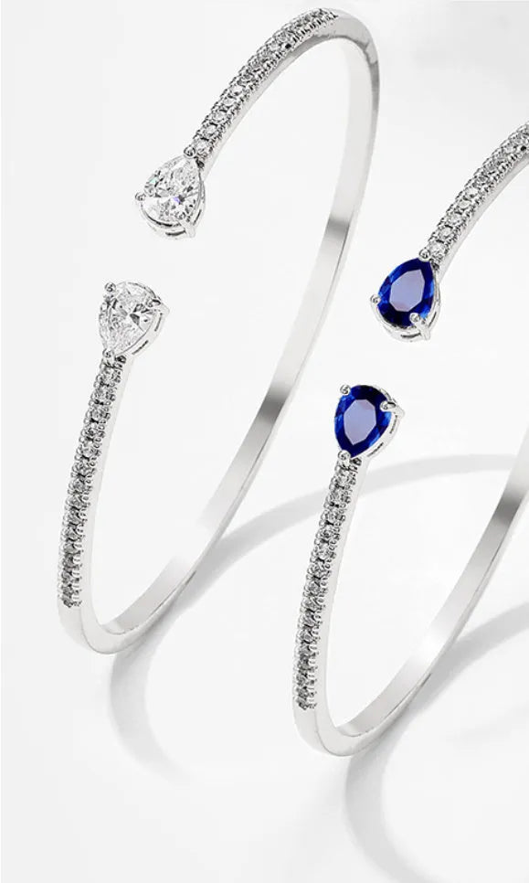 Copper multi-zircon bracelet with simple style in white colour option showing inlaid zircon treatment