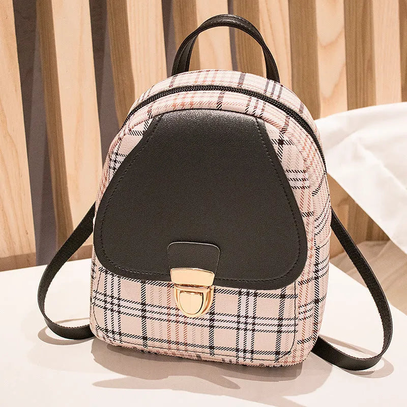 A diagonal one shoulder phone bag made from PU leather in a choice of five colours.