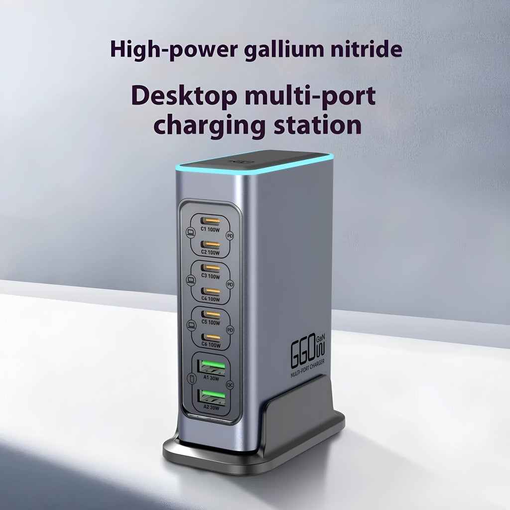 Silver 660W Gallium Nitride desktop fast charger with multiple USB-C ports on a wooden desk.