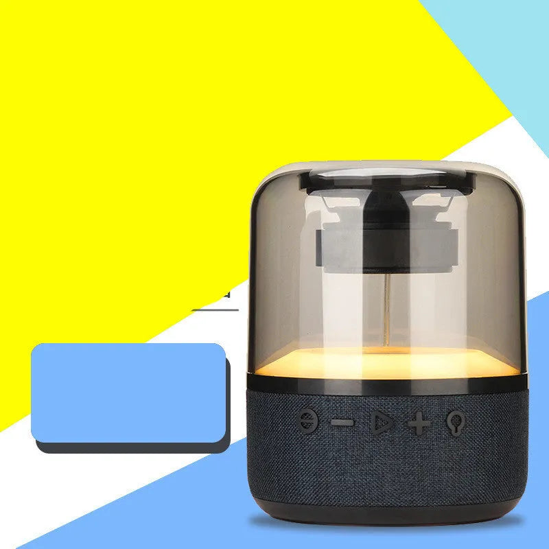 Black wireless Bluetooth speaker with touch controls and 360-degree sound projection