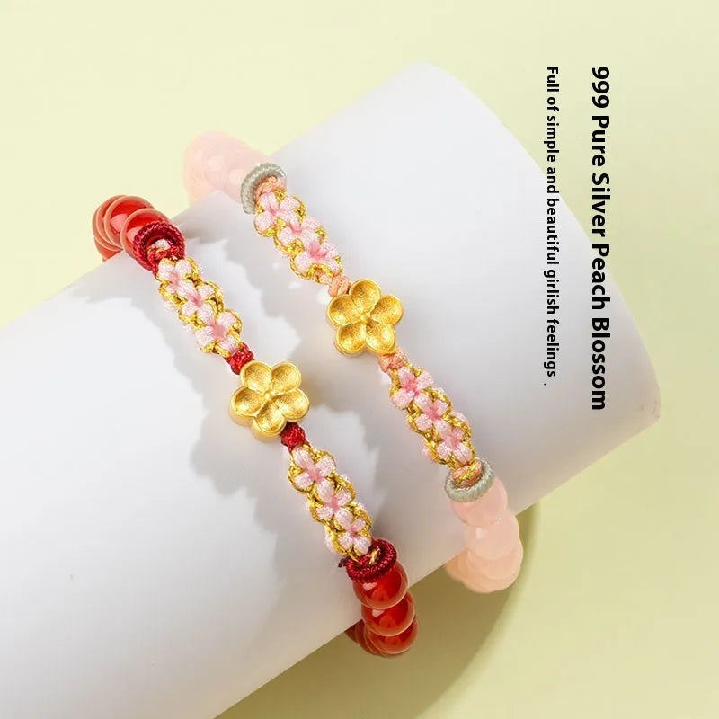 Chinese style peach blossom bracelet with hand-woven red rope strap and crystal centrepiece