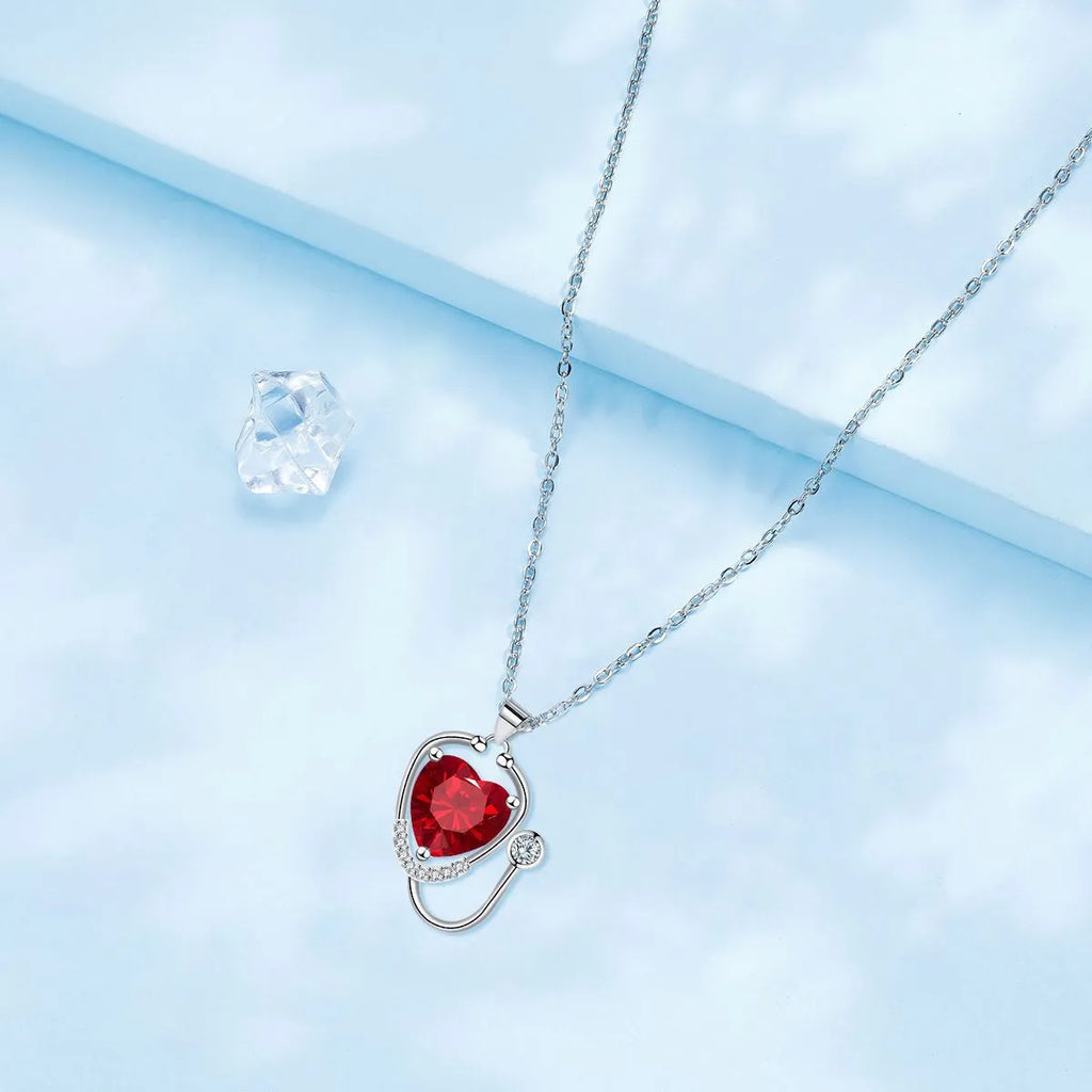 Women's copper stethoscope necklace with wings cross design in red diamond electroplated finish