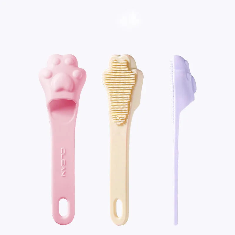 Silicone finger toothbrush for pets in pink, purple and yellow colours