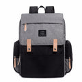 LAND Mommy large grey Oxford cloth diaper backpack with changing mat, shown on a table