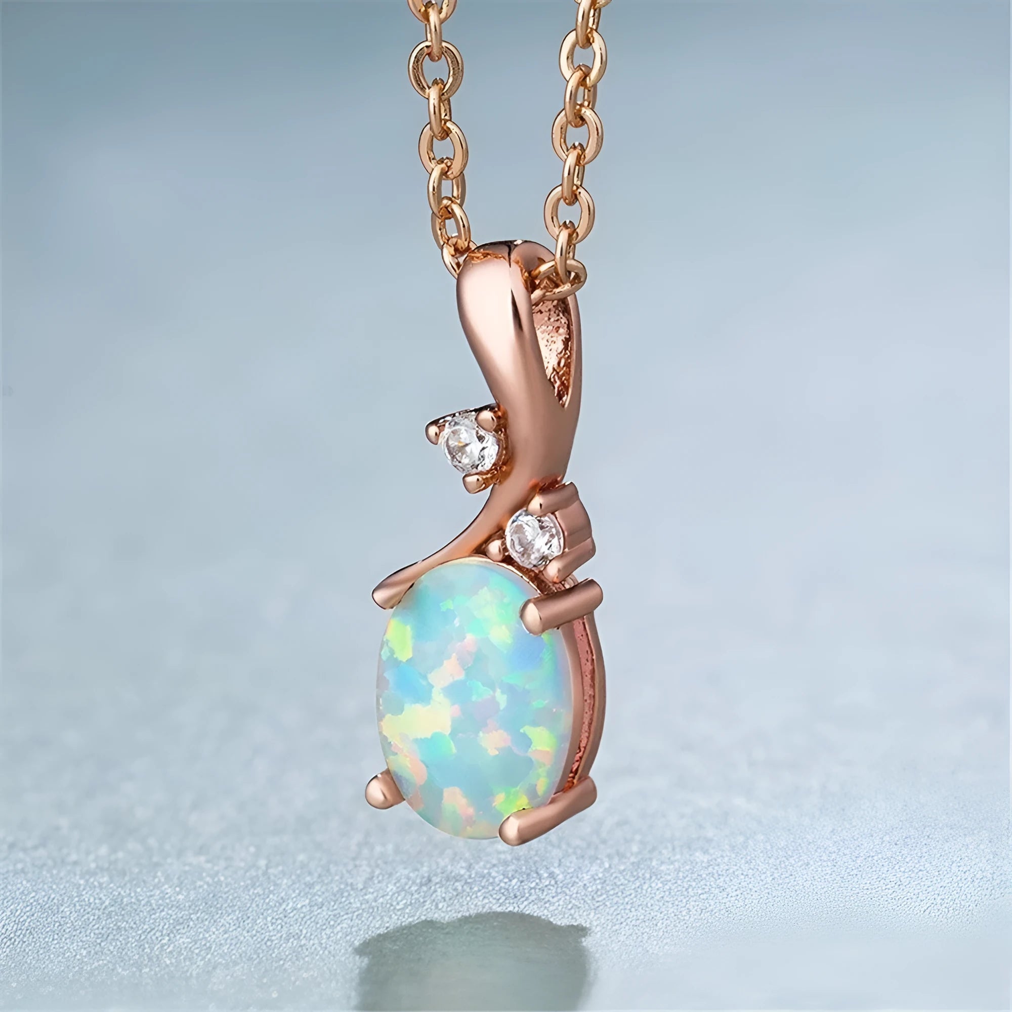 Water drop shaped opal pendant necklace on O-shaped chain in rose gold or white finish