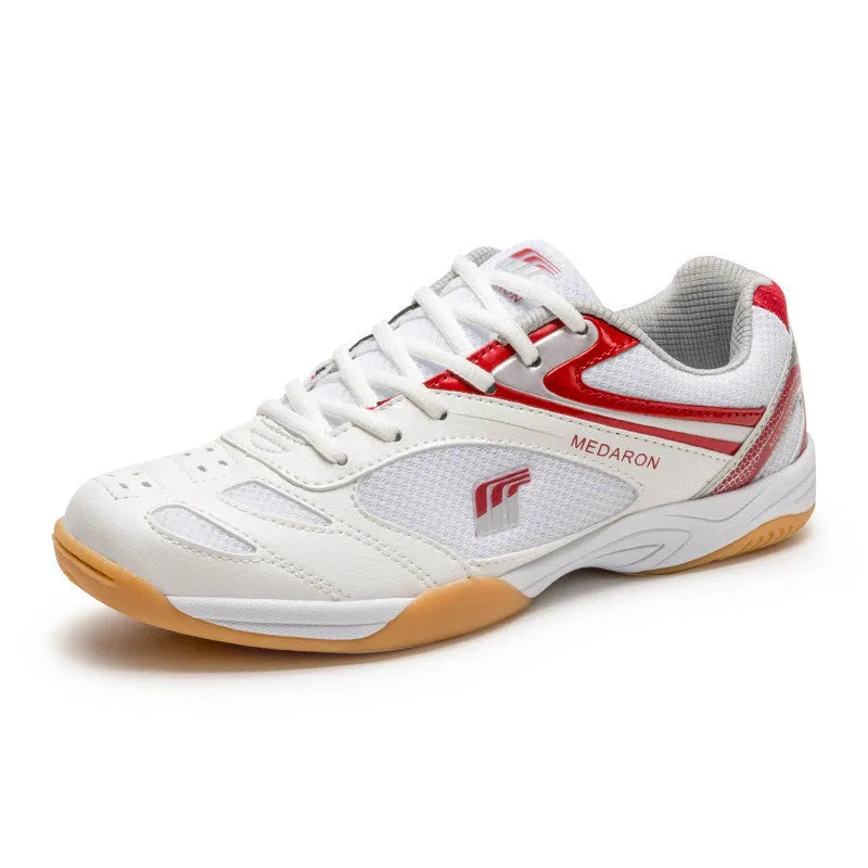 White and red table tennis sneakers with lace-up front and rubber sole.