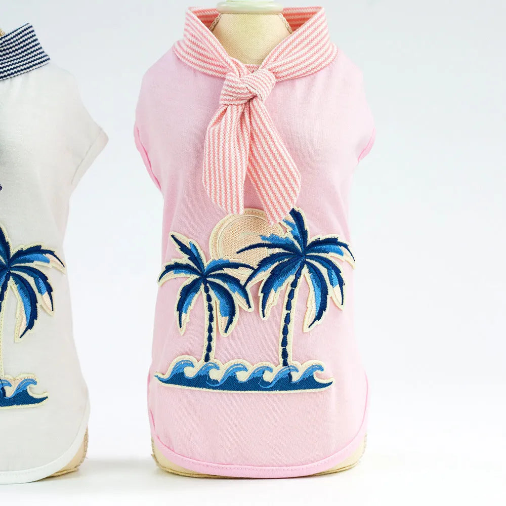 Pink cotton dog coat with coconut tree embroidery on a white background, size M shown