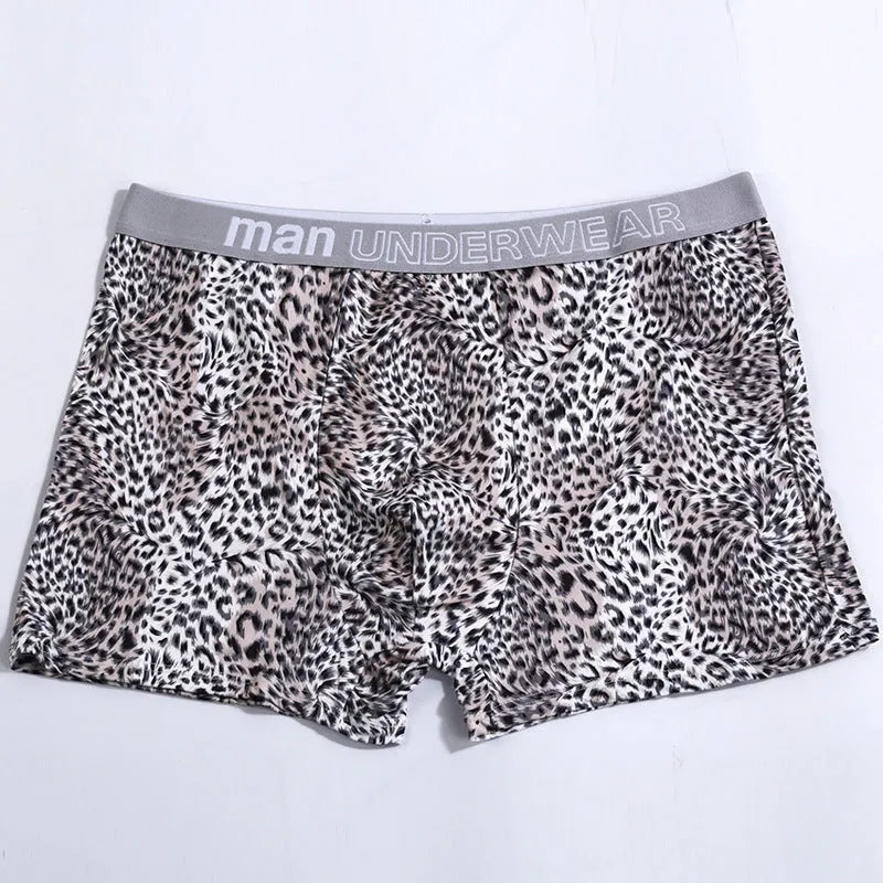 Men's loose leopard print underwear in milk silk polyester fabric showing mid waist design