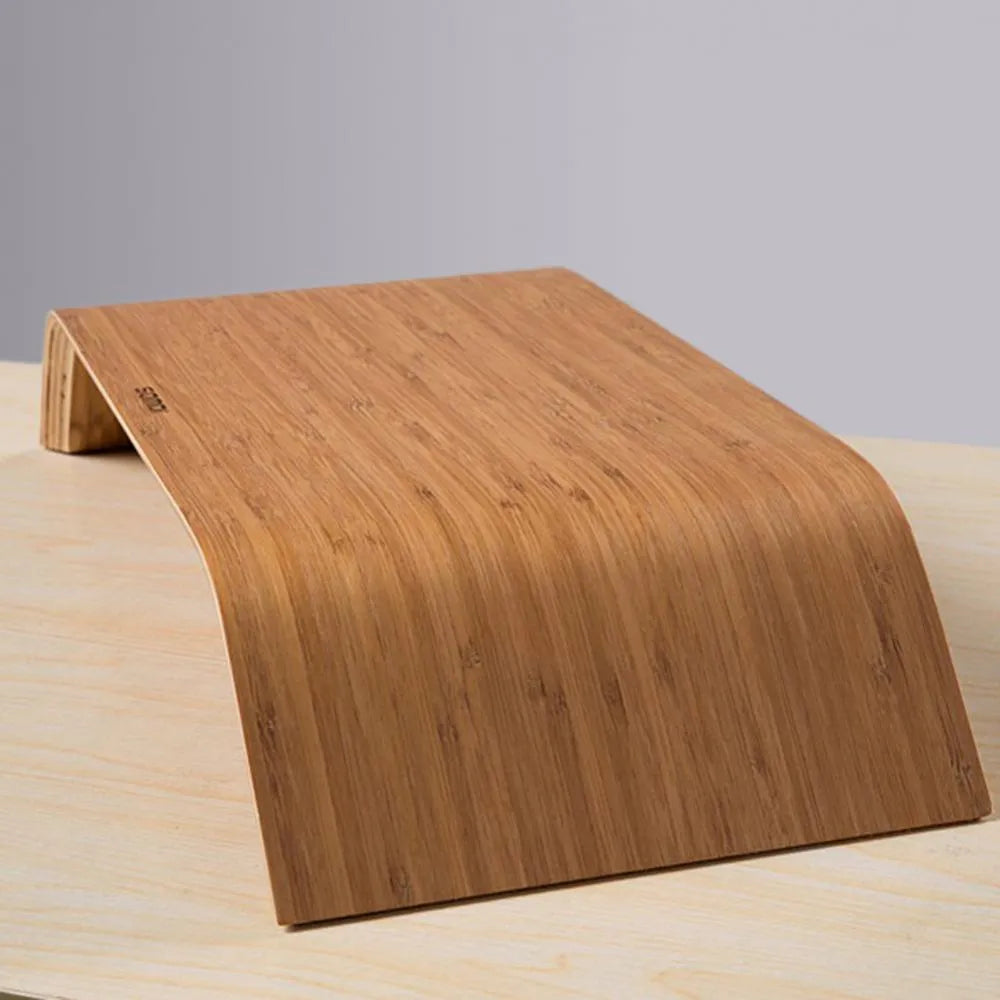 Walnut laptop stand with stability bracket in bamboo leather colour on a desk